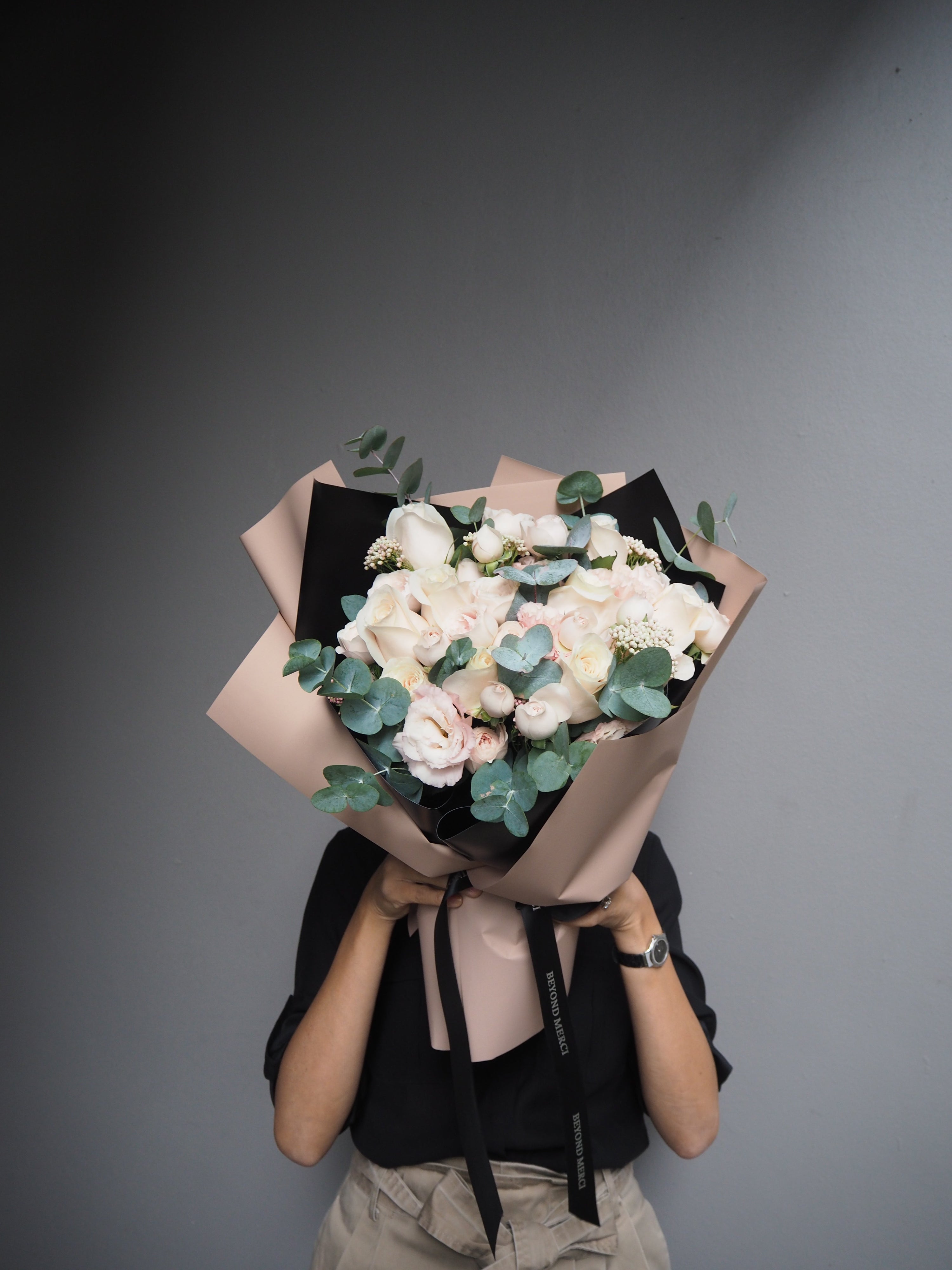 Lady holding flower bouquet