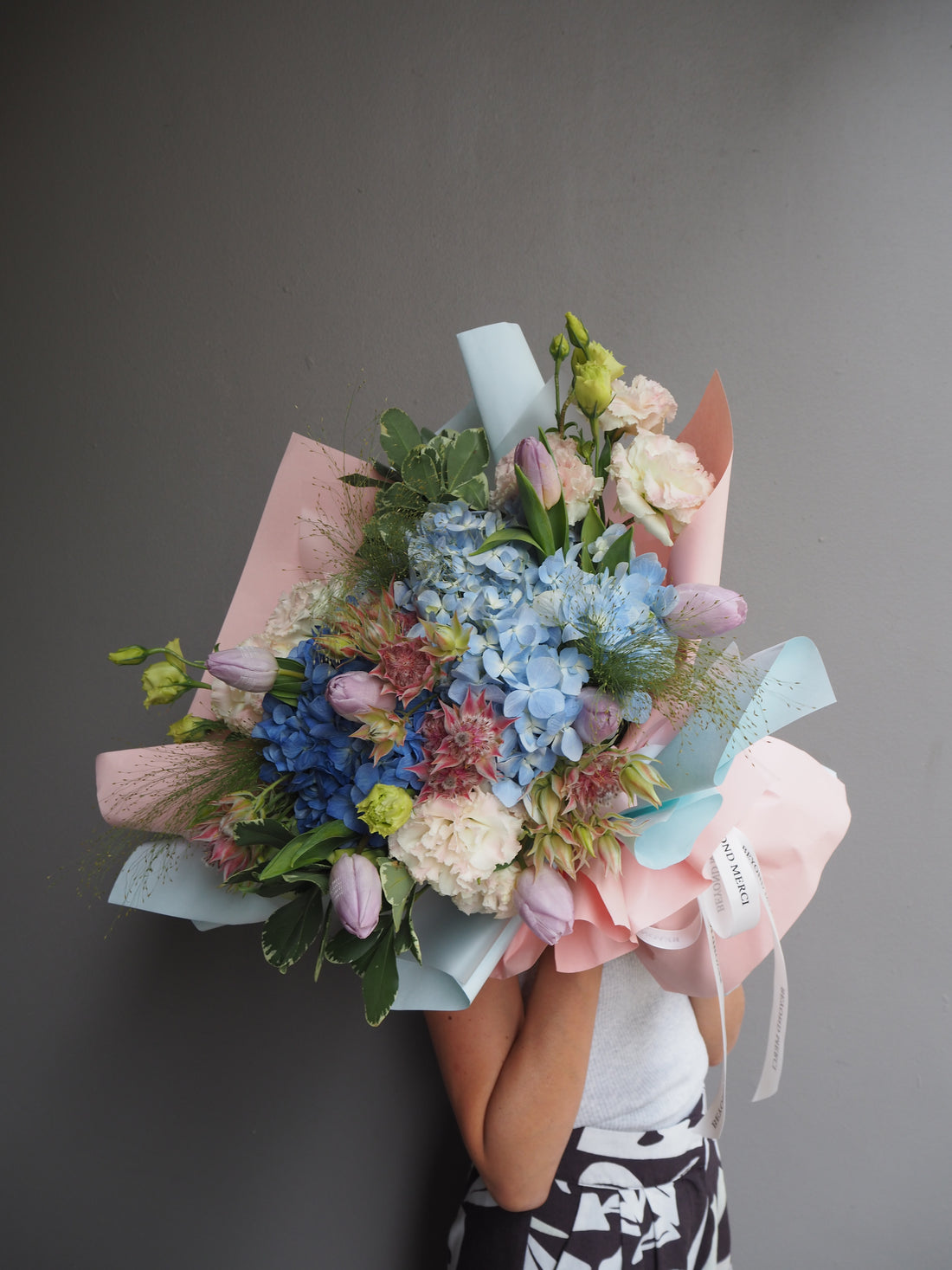 Luxury bouquet with blue hydrangea and pink tulips