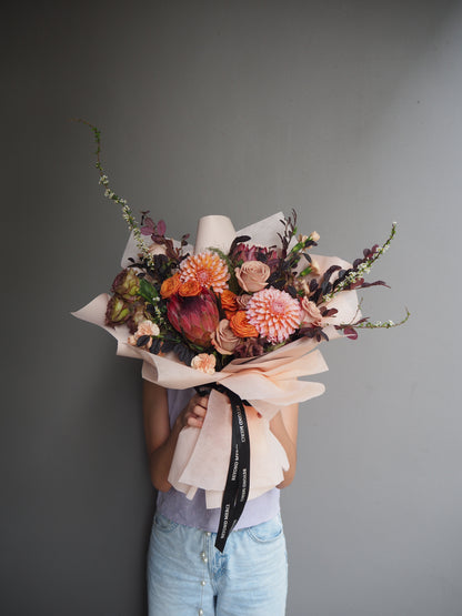 Premium bouquet of fresh flowers with cappucino rose, dahlia and protea for an autumn feel bouquet.