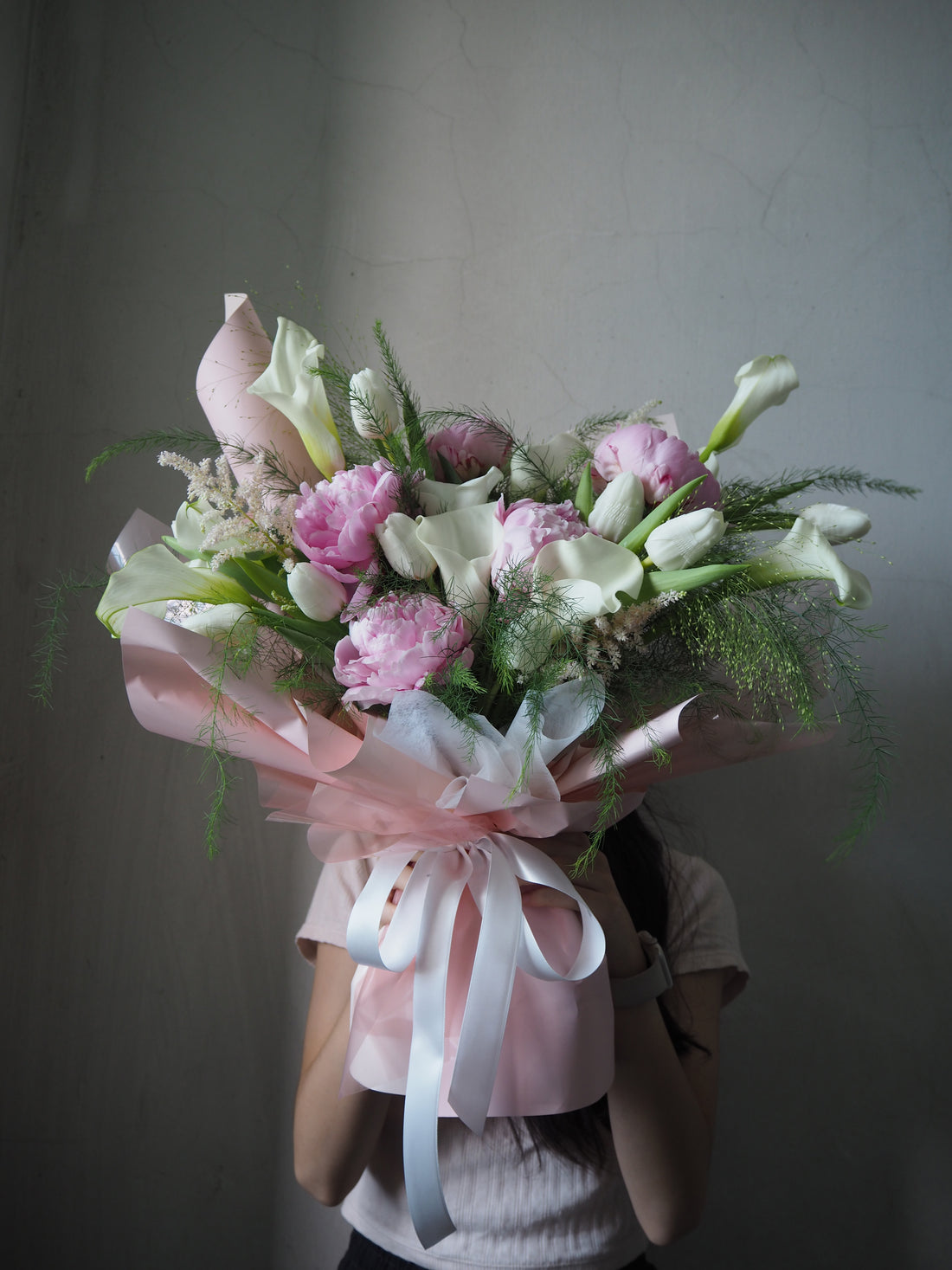 Premium peonies and calla lily fresh flower bouquet.
