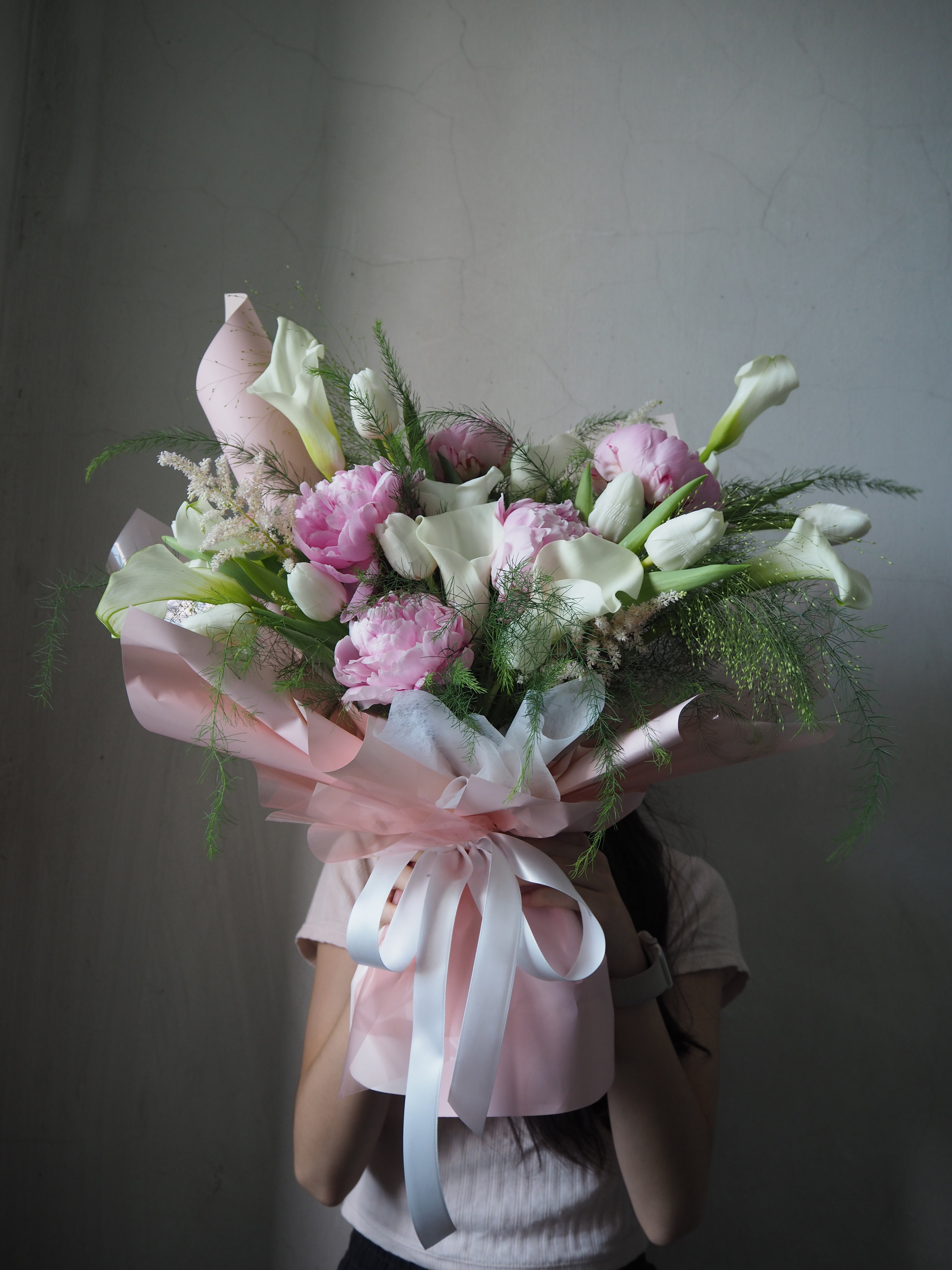 Premium peonies and calla lily fresh flower bouquet.
